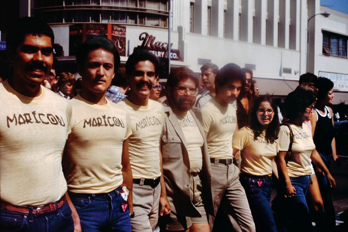 Participants in the Christopher Street West Pride parade Participants in the Christopher Street West Pride parade wearing Joey Terrill’s malflora and maricón T-shirts, June 1976. Photo by Teddy Sandoval. Courtesy of Paul Polubinskas